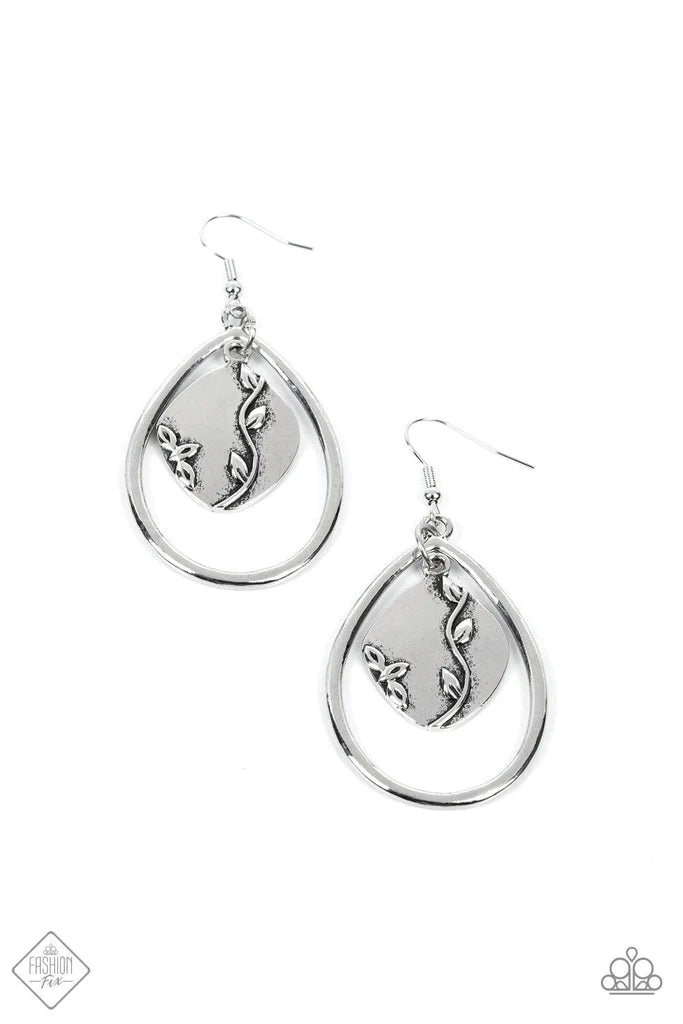 A cheerful pendant, embossed with shiny silver vines, swings freely within a teardrop frame for a seasonal style. Earring attaches to a standard fishhook fitting. Sold as one pair of earrings.