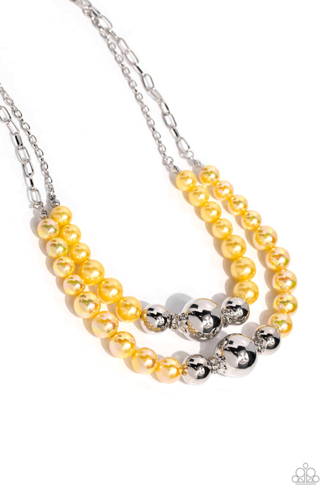 Infused along a silver paperclip and classic silver chain, a collection of glossy Lemon Drop pearls and high-sheen silver beads in various sizes cascade around the collar in layers for an elegant display. Features an adjustable clasp closure. Sold as one individual necklace. Includes one pair of matching earrings.pair of matching earrings.