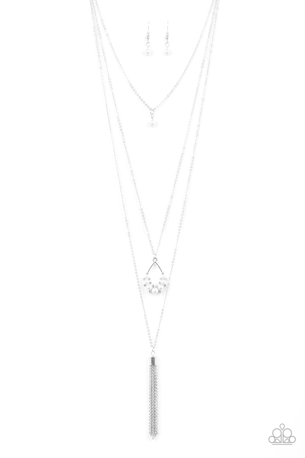A solitaire white pearl swings from the uppermost chain, giving way to a teardrop pendant and shimmery silver chain tassel. Dainty white rhinestones and white pearls collect at the bottom of the centermost pendant for a glamorous finish. Features an adjustable clasp closure.
Sold as one individual necklace. Includes one pair of matching earrings.