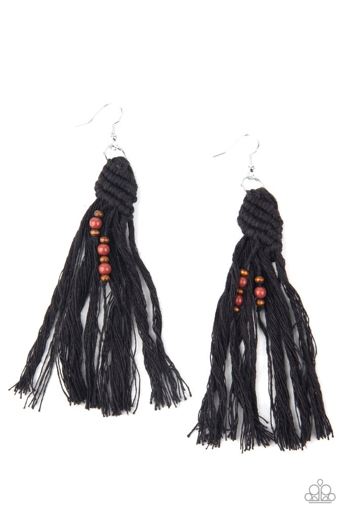 Dainty wooden and glassy brown beads are knotted in place along a knotted black tassel, creating a beach inspired macramé centerpiece. Earring attaches to a standard fishhook fitting. Sold as one pair of earrings.