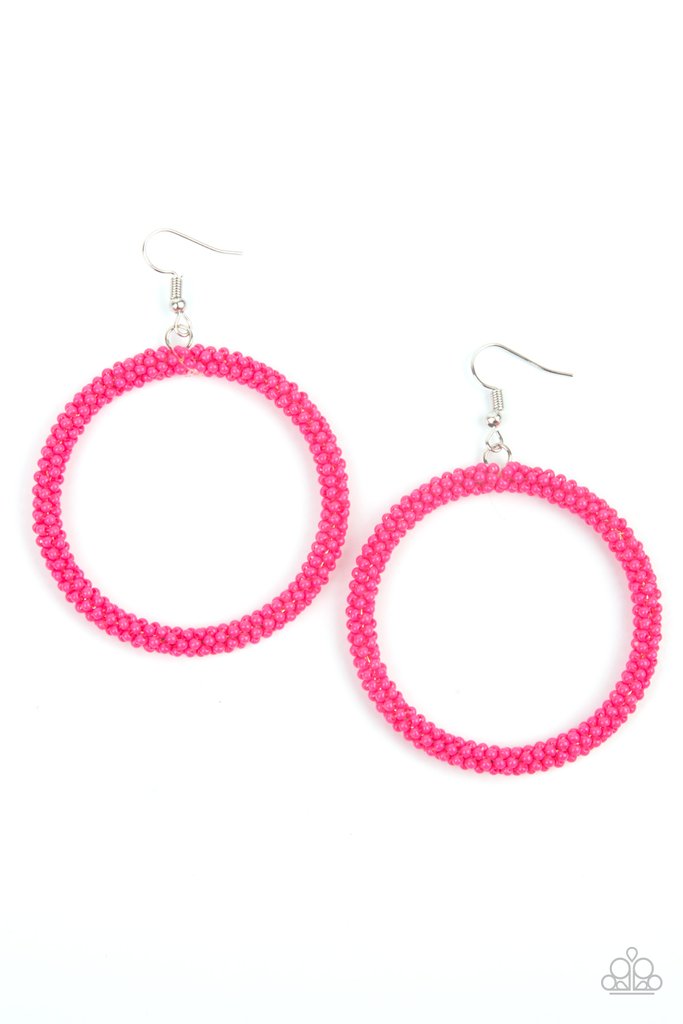 A dainty strand of vivacious pink seed beads wrap around a silver hoop, creating a bubbly hoop. Earring attaches to a standard fishhook fitting.
Sold as one pair of earrings.