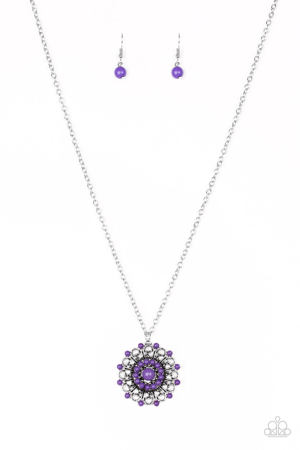 Vivacious purple beads are sprinkled along ornate silver petals, creating a colorful floral frame. The whimsical pendant swings from the bottom of a lengthened silver chain for a seasonal look. Features an adjustable clasp closure. Sold as one individual necklace. Includes one pair of matching earrings.