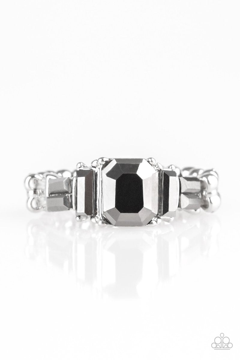 Varying in cut and shimmer, glittery hematite rhinestones stack into a glamorous band across the finger. Features a dainty stretchy band for a flexible fit. Sold as one individual ring.