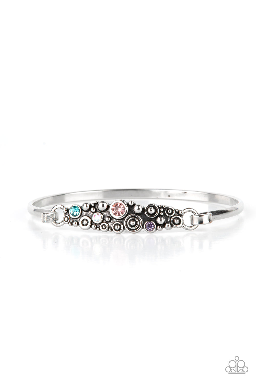A cluster of engraved and antiqued silver swirls merge with colorful rhinestones and coalesce into a whimsical display across the wrist on a dainty silver cuff. Features a hook and eye closure. Sold as one individual bracelet.