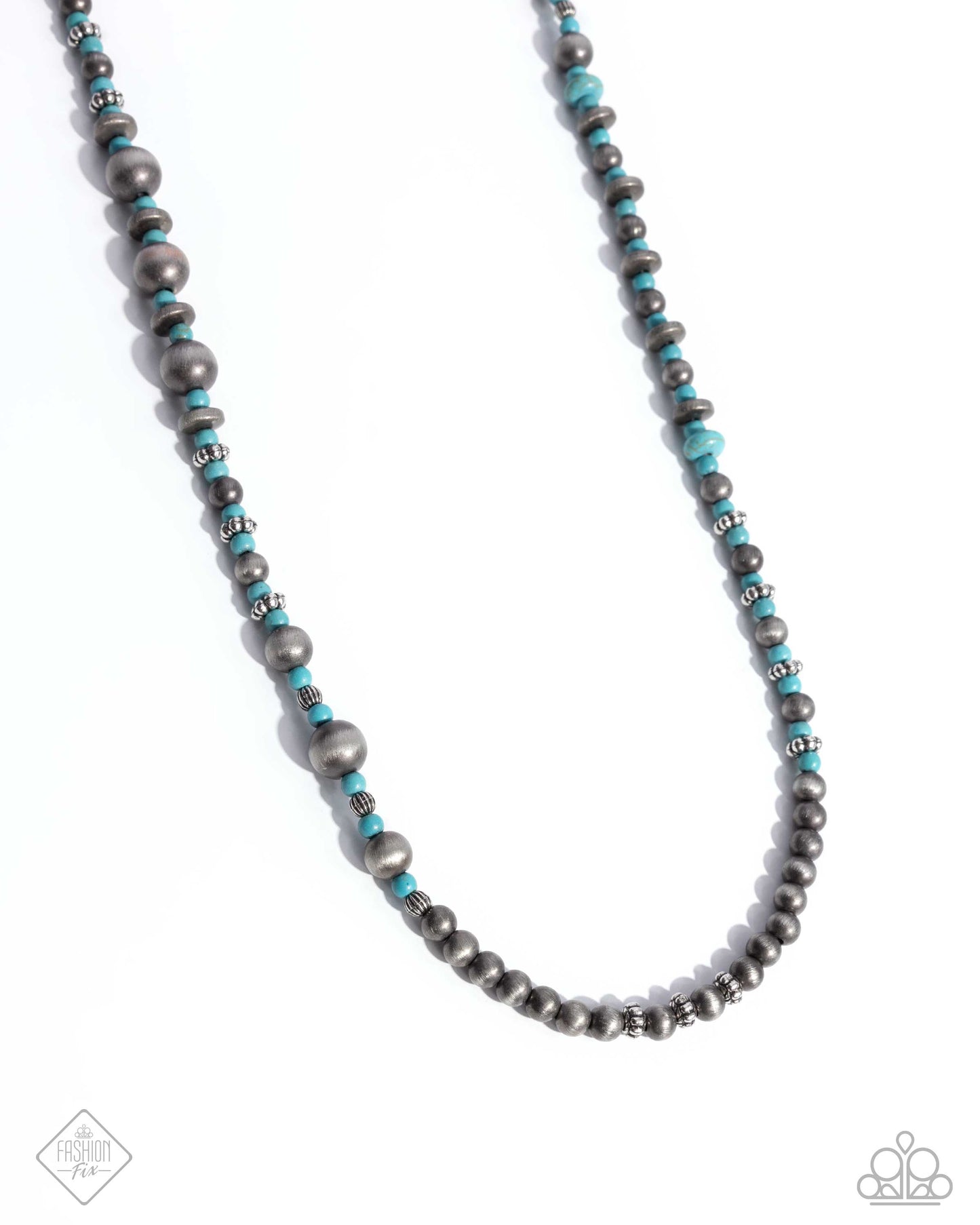 Infused along an invisible string, a collection of Navajo pearls, turquoise beads, and silver beads in varying sizes loop around the neckline for a delicate, desert-inspired display. Features an adjustable clasp closure. As the stone elements in this piece are natural, some color variation is normal. Sold as one individual necklace. Includes one pair of matching earrings.