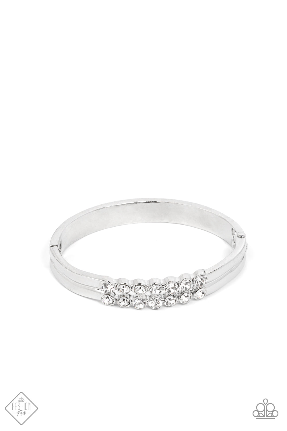 Stacked layers of brilliant white rhinestones give way to double layers of sleek silver frames that feature a subtle wave, creating a dramatically modern design around the wrist. Features a hinged closure. Sold as one individual bracelet.