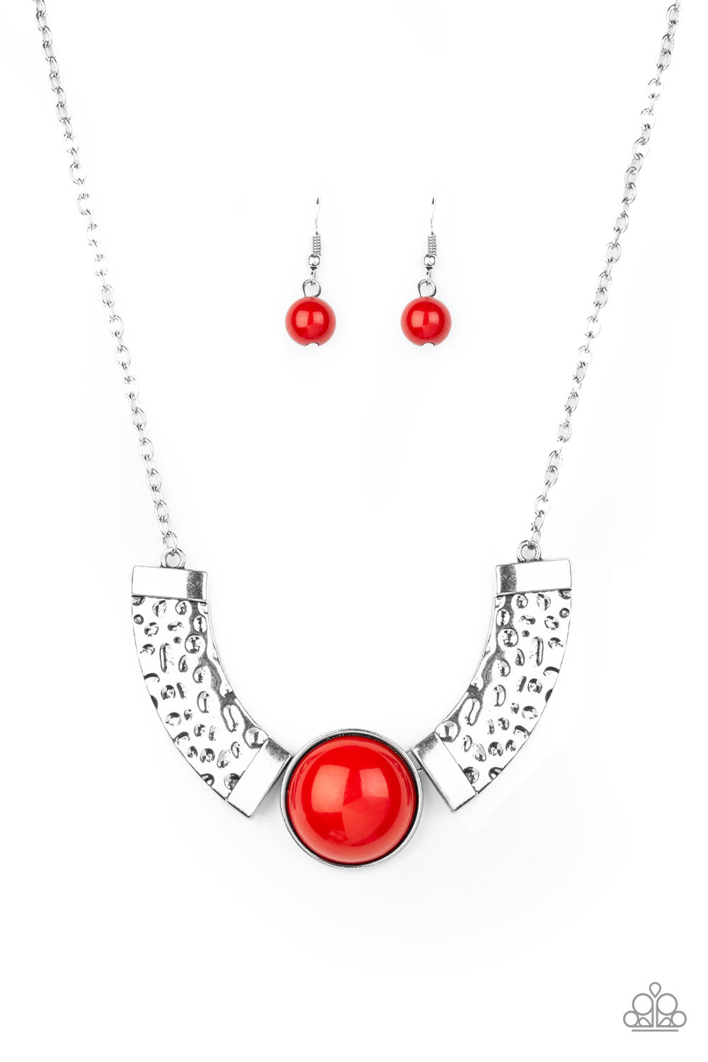 Dramatic silver plates connect with a shiny red beaded center, creating an indigenous collar-like pendant. The shiny silver plates are delicately hammered, adding a flashy metallic texture to the tribal inspired palette. Features an adjustable clasp closure. Sold as one individual necklace. Includes one pair of matching earrings.