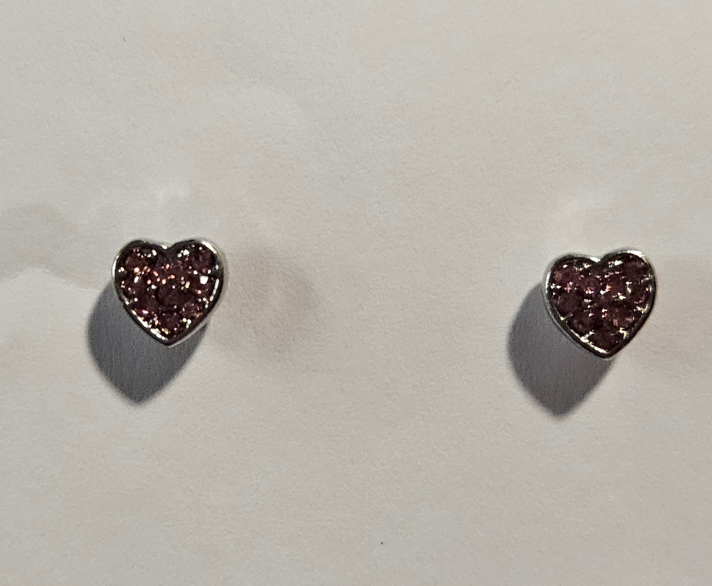 Kids' silver heart shaped earrings with pink rhinestones