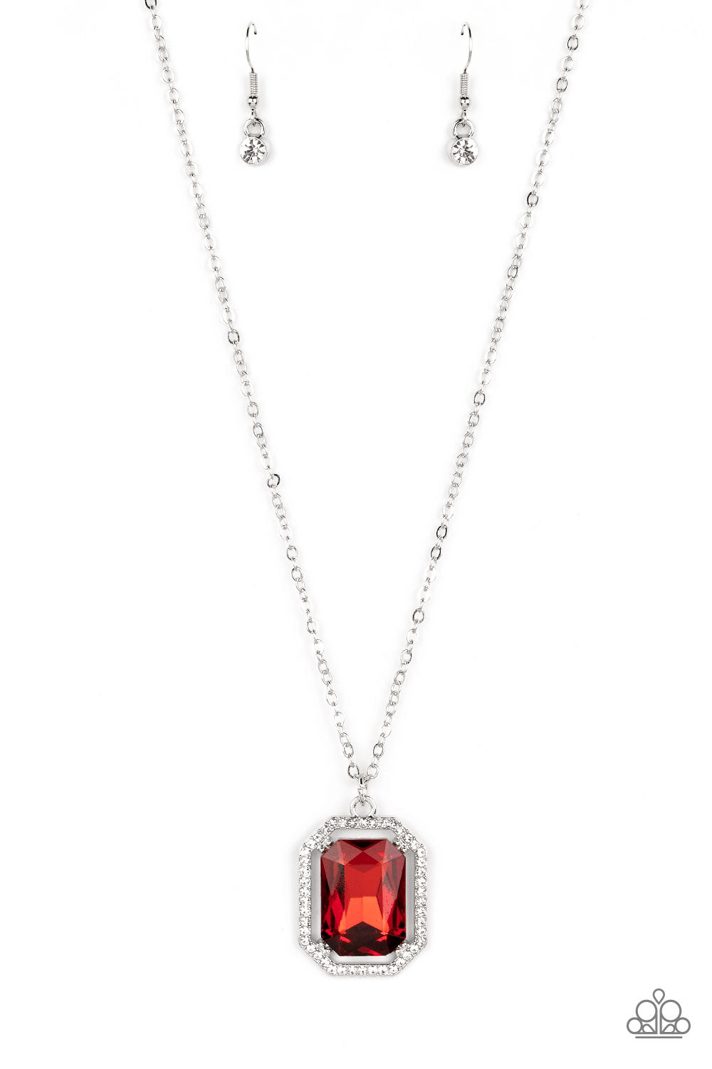 A dramatically oversized, emerald-cut red gem shimmers as it swings from the bottom of a long silver chain. Dainty white rhinestones create an airy frame that wrap around the reflective centerpiece, scattering light in every direction in a blinding finish. Features an adjustable clasp closure. Sold as one individual necklace. Includes one pair of matching earrings.