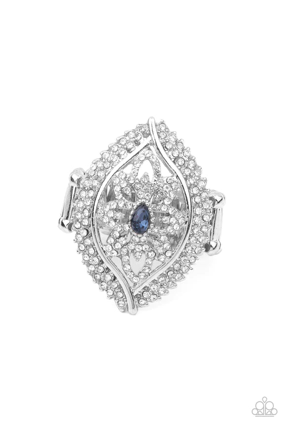 Encrusted in icy white rhinestones, glittery silver petals bloom from a sparkly blue teardrop rhinestone center, creating a glamorous centerpiece inside a frame of dramatically double-bordered rows of white rhinestones. Features a stretchy band for a flexible fit. Sold as one individual ring.