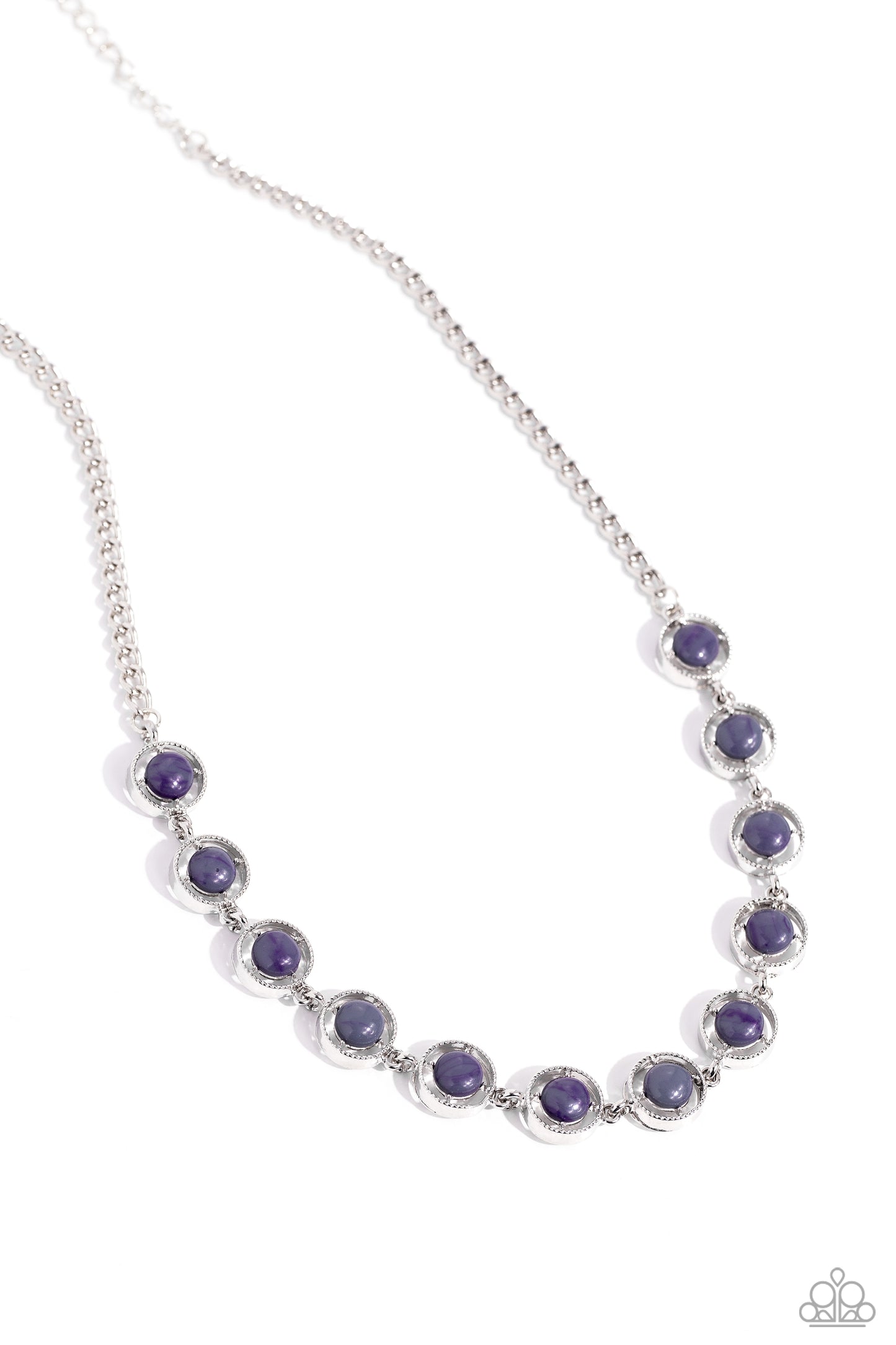 A dainty series of serrated silver rings are fitted with pronged gray beaded centers as they delicately link below the collar from a classic silver chain, resulting in a seasonal statement. Features an adjustable clasp closure. Sold as one individual necklace. Includes one pair of matching earrings.