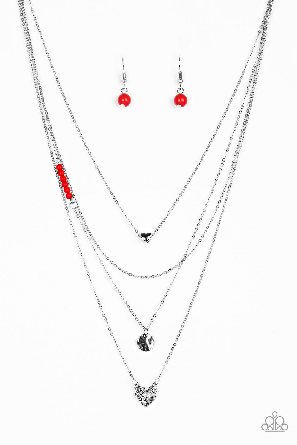 Shimmery silver layers cascade below the collar. Infused with hints of fiery red beading, dainty silver hearts and a delicately hammered silver disc swing from the bottoms of the chains for a whimsical finish. Features an adjustable clasp closure. Sold as one individual necklace. Includes one pair of matching earrings. Sold as one individual necklace. Includes one pair of matching earrings.