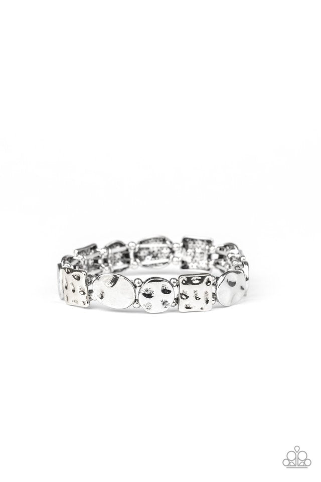 Infused with dainty silver beads, an asymmetrical collection of hammered square and round silver frames are threaded along stretchy bands around the wrist for a simple artisan inspired look.
Sold as one individual bracelet.