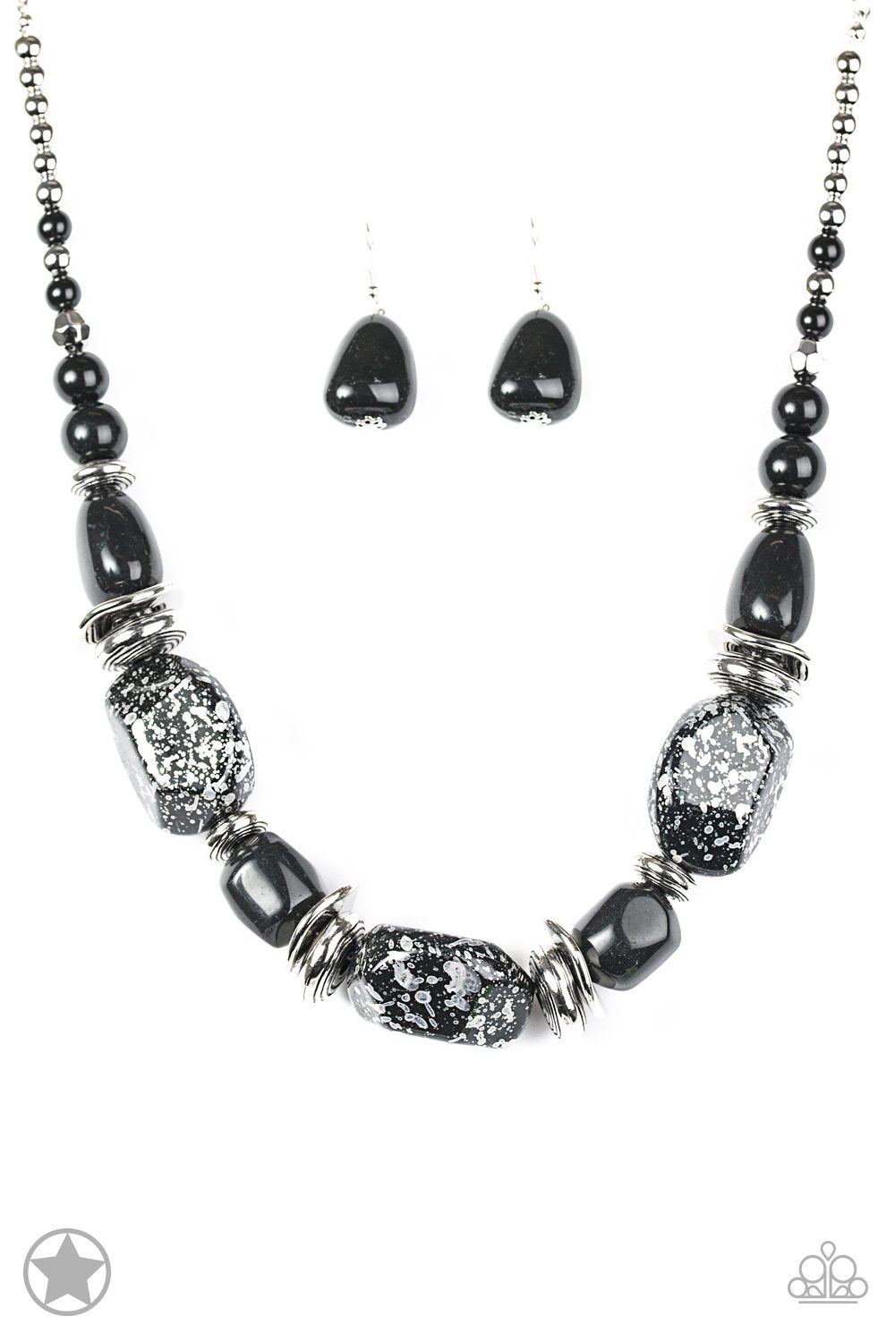 Chunky black beads with speckles of silver and a gorgeous glazed finish are threaded together with thick silver rings and smooth black beads. Features an adjustable clasp closure. Includes a pair of matching earrings.