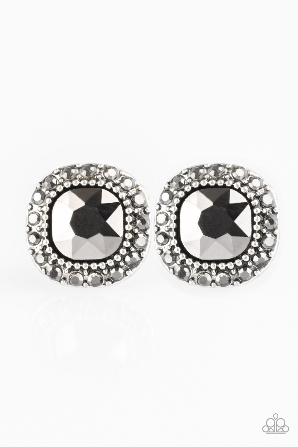 An oversized hematite gem is pressed into the center of a studded silver frame radiating with glittery hematite rhinestones for a timeless look. Earring attaches to a standard post fitting. Sold as one pair of post earrings.