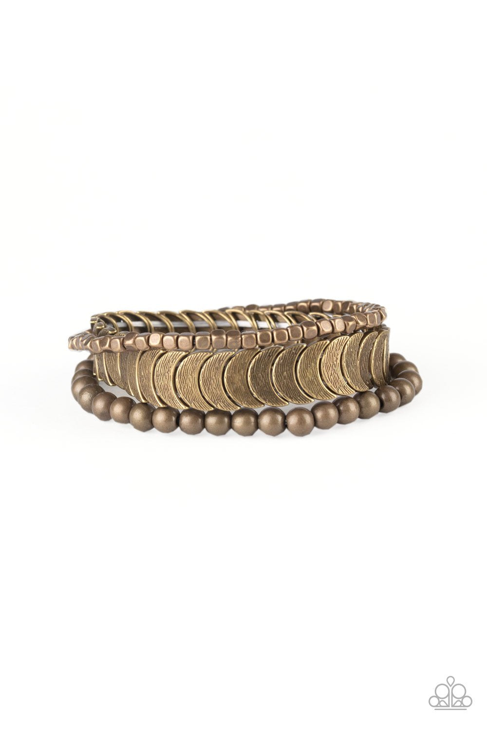 Featuring round, cube, and half-moon shapes, mismatched brass beads are threaded along stretchy bands, creating trendy mixed metallic layers around the wrist.
Sold as one set of three bracelets.