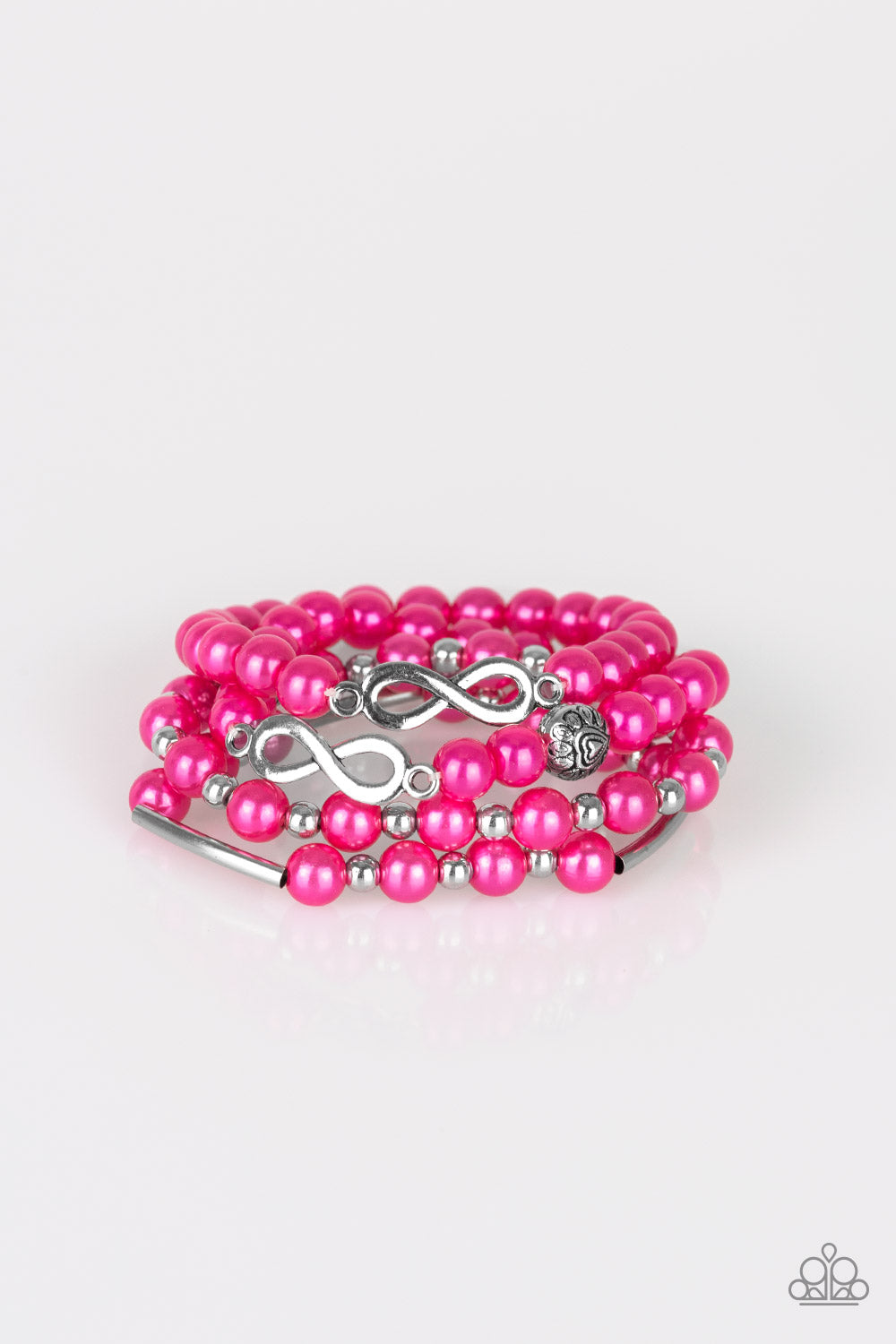 Infused with an array of silver accents, a collection of pink pearls and silver infinity charms are threaded along stretchy bands around the wrist for a glamorous look.
Sold as one set of three bracelets.