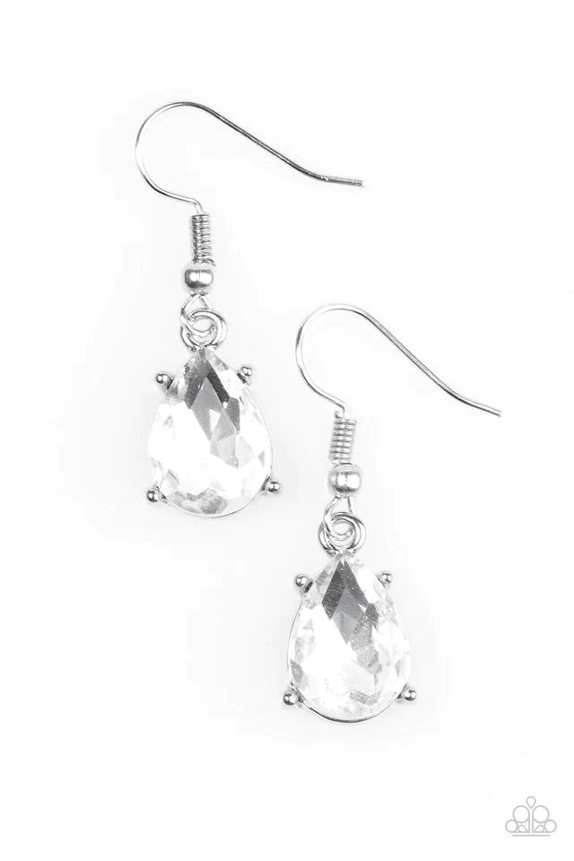 Featuring a regal teardrop cut, a glittery white rhinestone is pressed into a sleek silver frame, creating an edgy shimmer. Earring attaches to a standard fish hook setting. Sold as one pair of earrings.