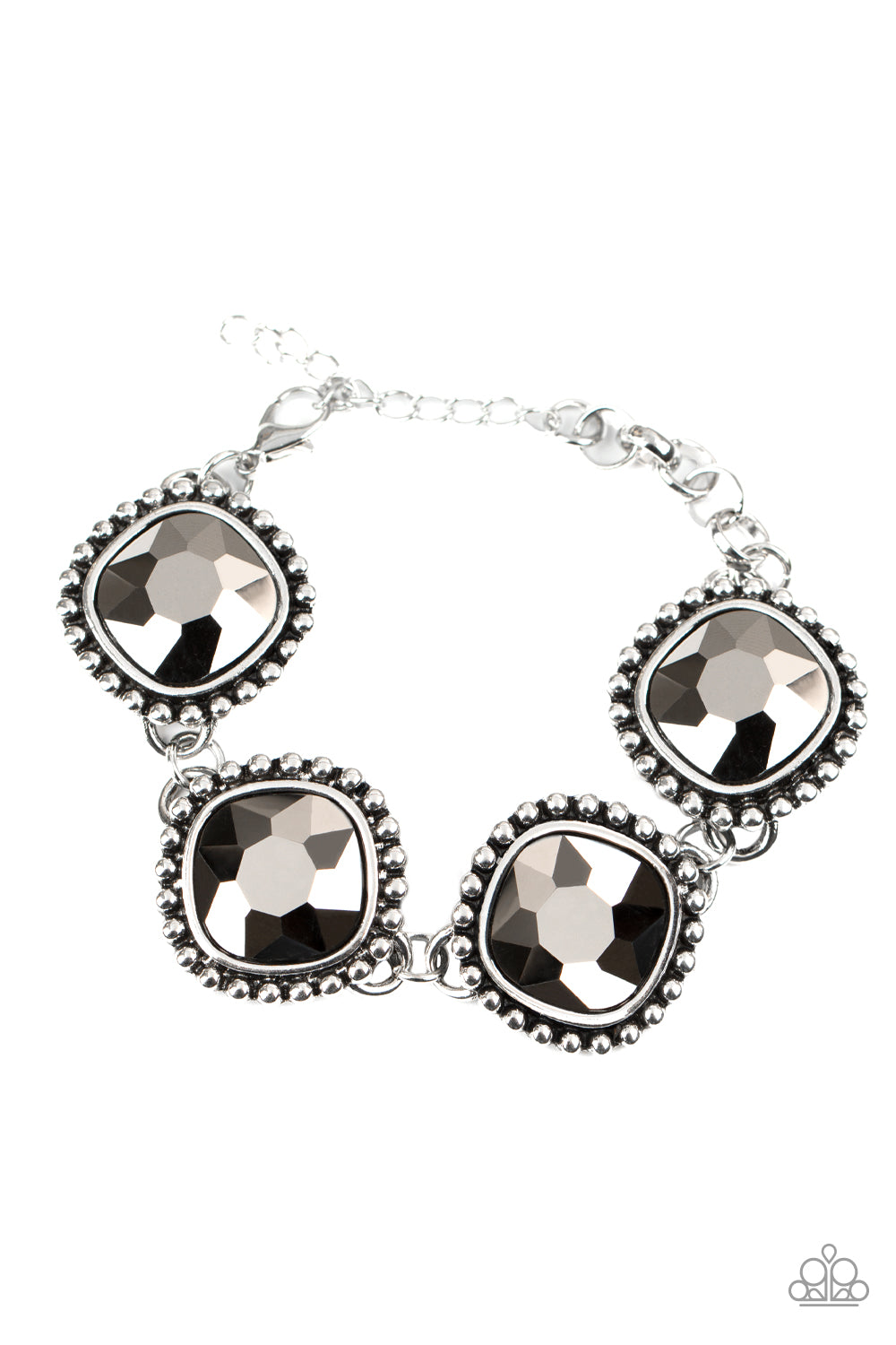 Featuring dramatically studded silver frames, an exaggerated display of oversized hematite rhinestone encrusted frames delicately link around the wrist for a blinding look. Features an adjustable clasp closure.
Sold as one individual bracelet.