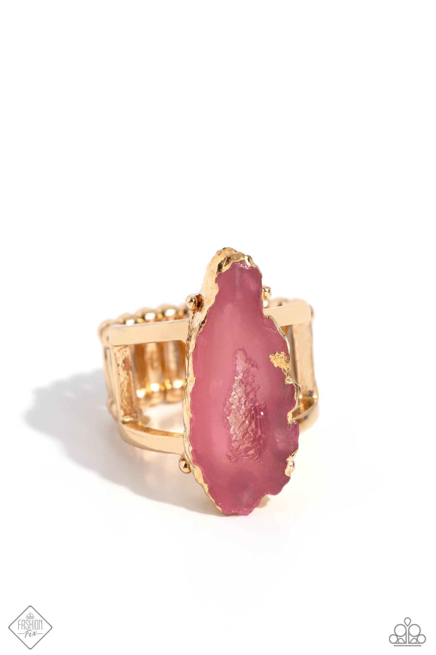 Featured atop airy gold bands, a pink geode stone with druzy-like accents is encased in gold foiling for a decadently earthy centerpiece atop the finger. Features a stretchy band for a flexible fit. As the stone elements in this piece are natural, some color variation is normal. Sold as one individual ring.