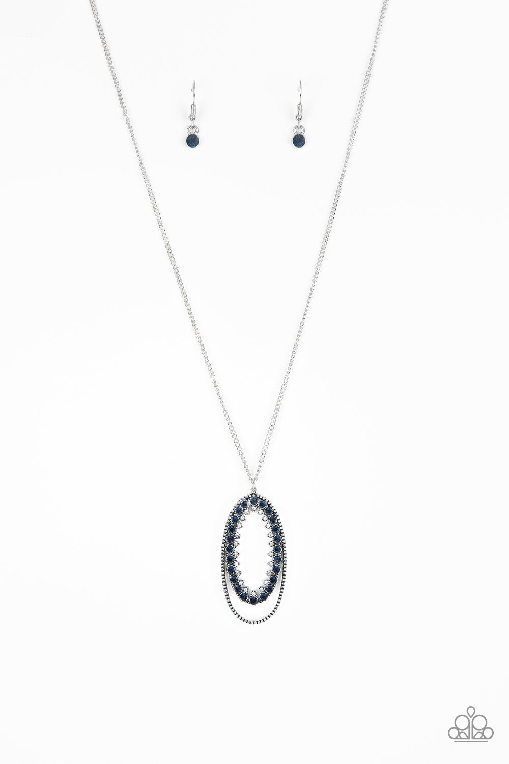 Ringed in a studded silver frame, glittery blue and white rhinestones collect into a glamorous pendant at the bottom of a lengthened silver chain for a refined flair. Features an adjustable clasp closure. Sold as one individual necklace. Includes one pair of matching earrings.