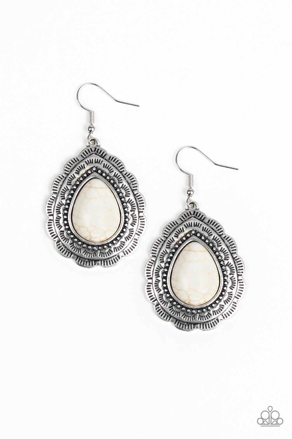 Chiseled into a tranquil teardrop, a refreshing white stone is pressed into a scalloped silver frame radiating with tribal inspired patterns for a seasonal look. Earring attaches to a standard fishhook fitting. Sold as one pair of earrings.