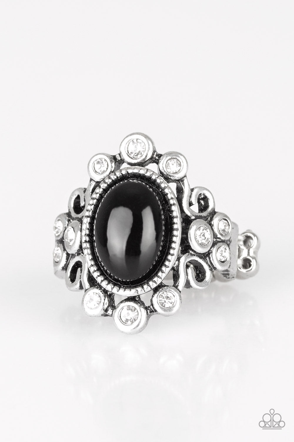 A polished black bead is pressed into a bubbly silver frame radiating with glassy white rhinestones for a notable finish. Features a stretchy band for a flexible fit. Sold as one individual ring.