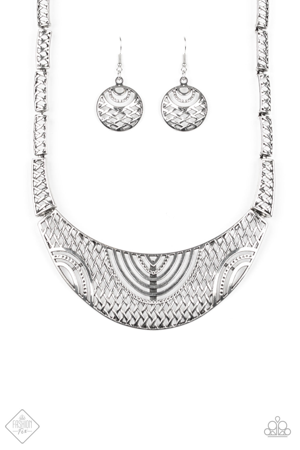 Swirling with ornate filigree filled detail, a shimmery silver crescent plate swings below the collar for a fierce look. Features an adjustable clasp closure. Sold as one individual necklace. Includes one pair of matching earrings.