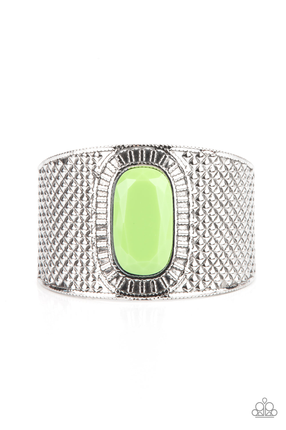 An oversized faceted green bead is pressed into the center of a thick silver cuff embossed in diamond-like textures, creating a bold tribal inspired centerpiece around the wrist. Sold as one individual bracelet.