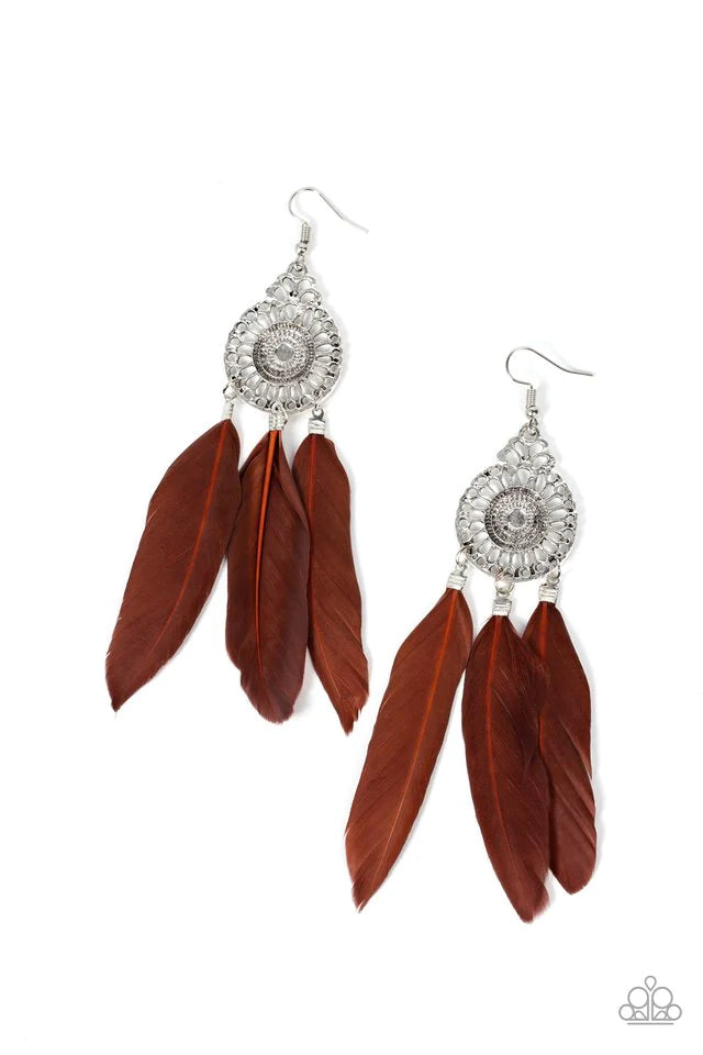 Three brown feathers swing from the bottom of a dizzying silver frame featuring airy filigree detail, resulting in a flirtatiously colorful fringe. Earring attaches to a standard fishhook fitting. Sold as one pair of earrings.