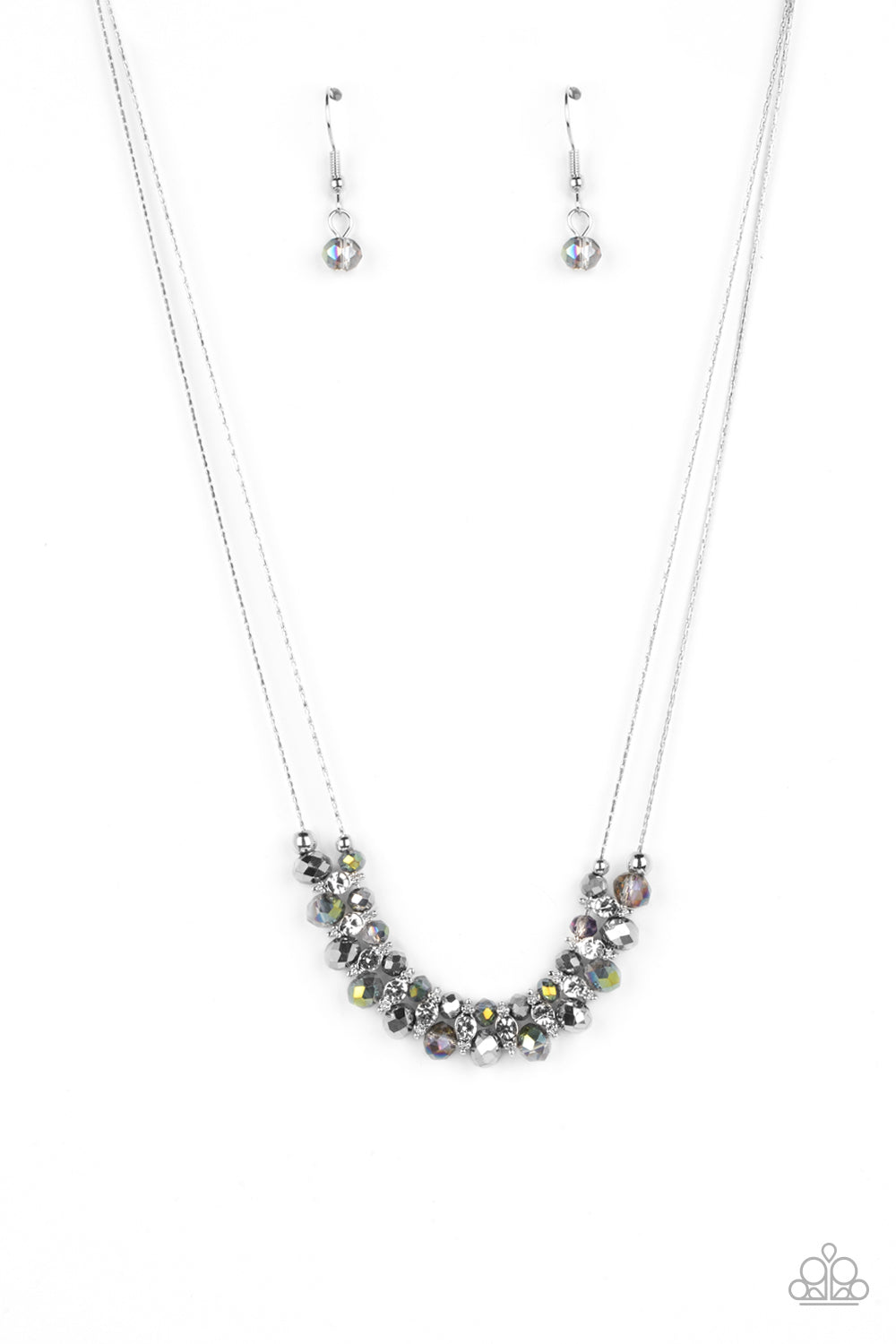 Strung between two dainty rows of silver wheat chain, a glistening collection of glassy beads, white rhinestones, and silver accents rests below the collar. The double layer of glassy beads that reflect various colors, are separated by the silver accents featuring dainty white rhinestones in its center, for an understated shimmer. Features an adjustable clasp closure. Sold as one individual necklace. Includes one pair of matching earrings.