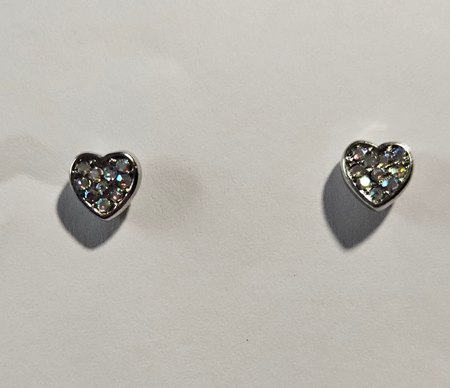 Kids' silver heart shaped earrings with white rhinestones