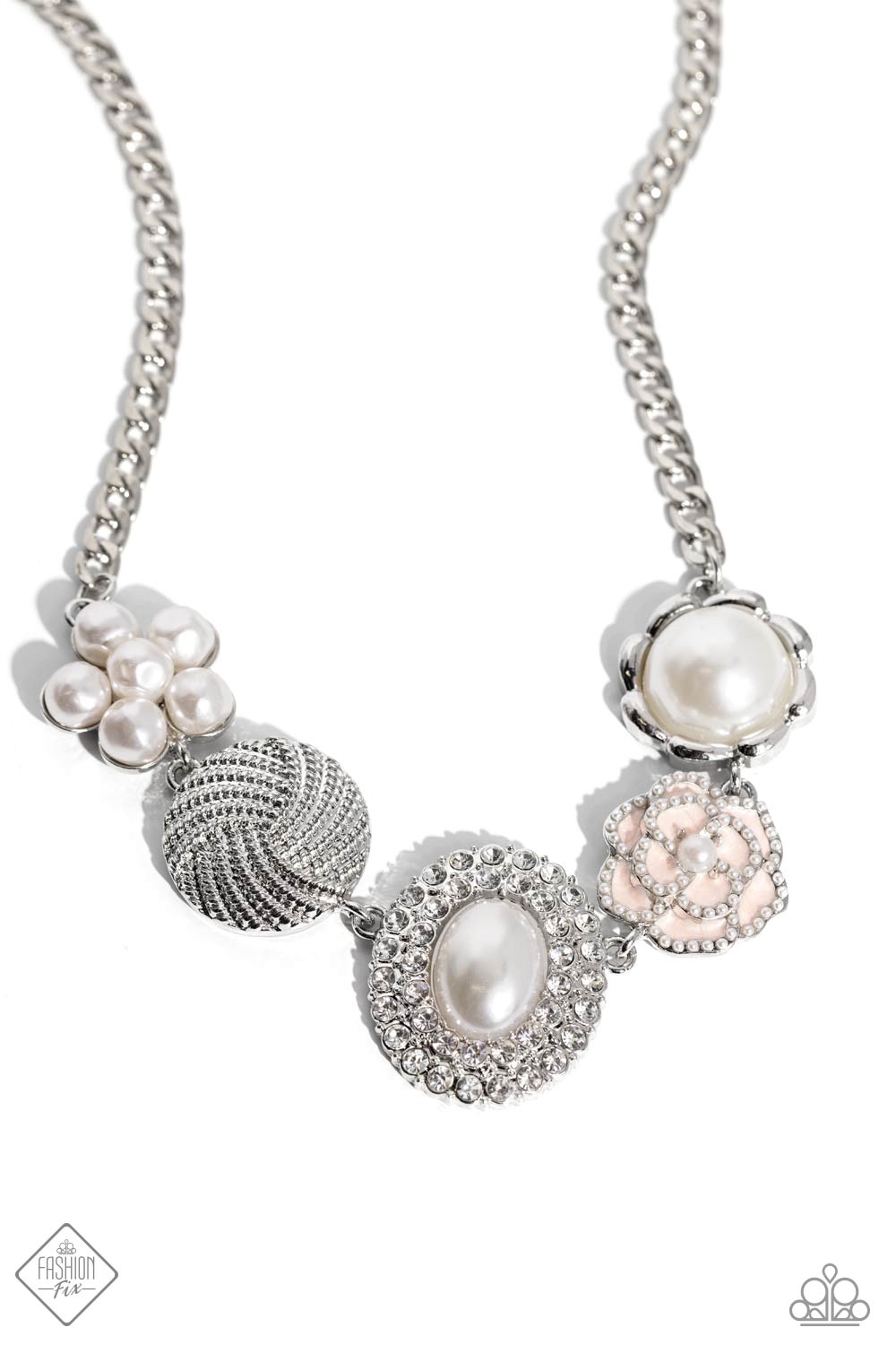 A refined display of shimmery pearl charms and floral-inspired accents gather below the collar creating a cultivated display. The hodgepodge of texture and sheen includes pearl-adorned flowers in various shapes, borders of white rhinestones around an oval pearl center, and tactile silver studs emanating in a twisted pattern. Features an adjustable clasp closure. Sold as one individual necklace. Includes one pair of matching earrings.