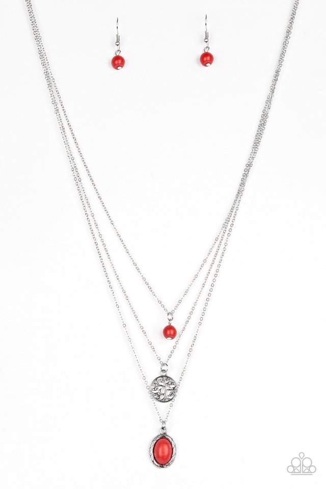 Women's silver multiple necklaces with red craclestone bead, silver cirlce disk with cutouts, and an oval red cracklestone (with red cracklestone bead earrings)