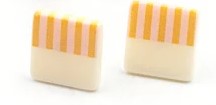 Kids' square shaped earrings with white on one half and peach with darker peach stripes on the other half