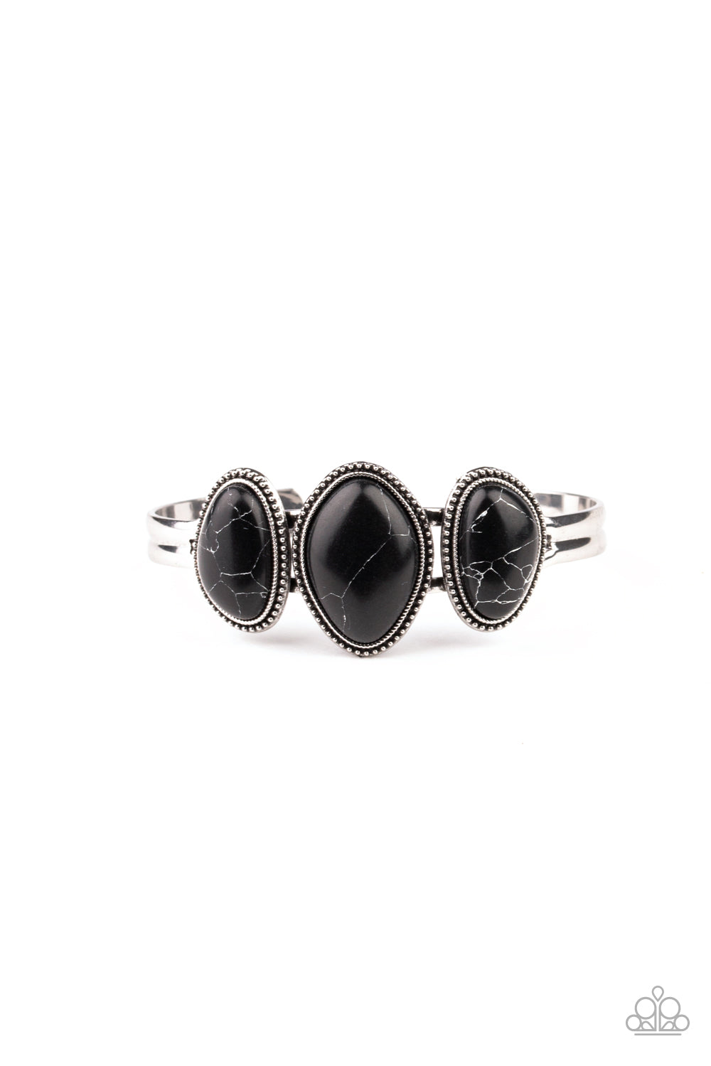 Featuring asymmetrical shapes, a trio of earthy black stones are pressed into studded silver frames atop a dainty silver cuff for a rustic look. Sold as one individual bracelet.