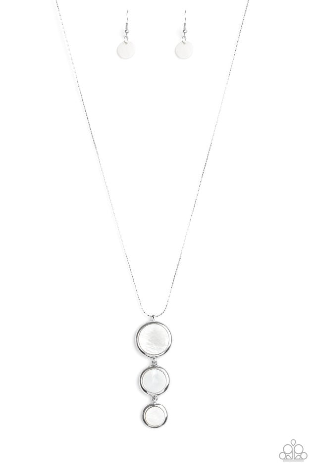Featuring sleek silver fittings, white shell-like discs gradually increase in size as they connect at the bottom of a dainty silver chain for a summery look. Features an adjustable clasp closure. Sold as one individual necklace. Includes one pair of matching earrings.