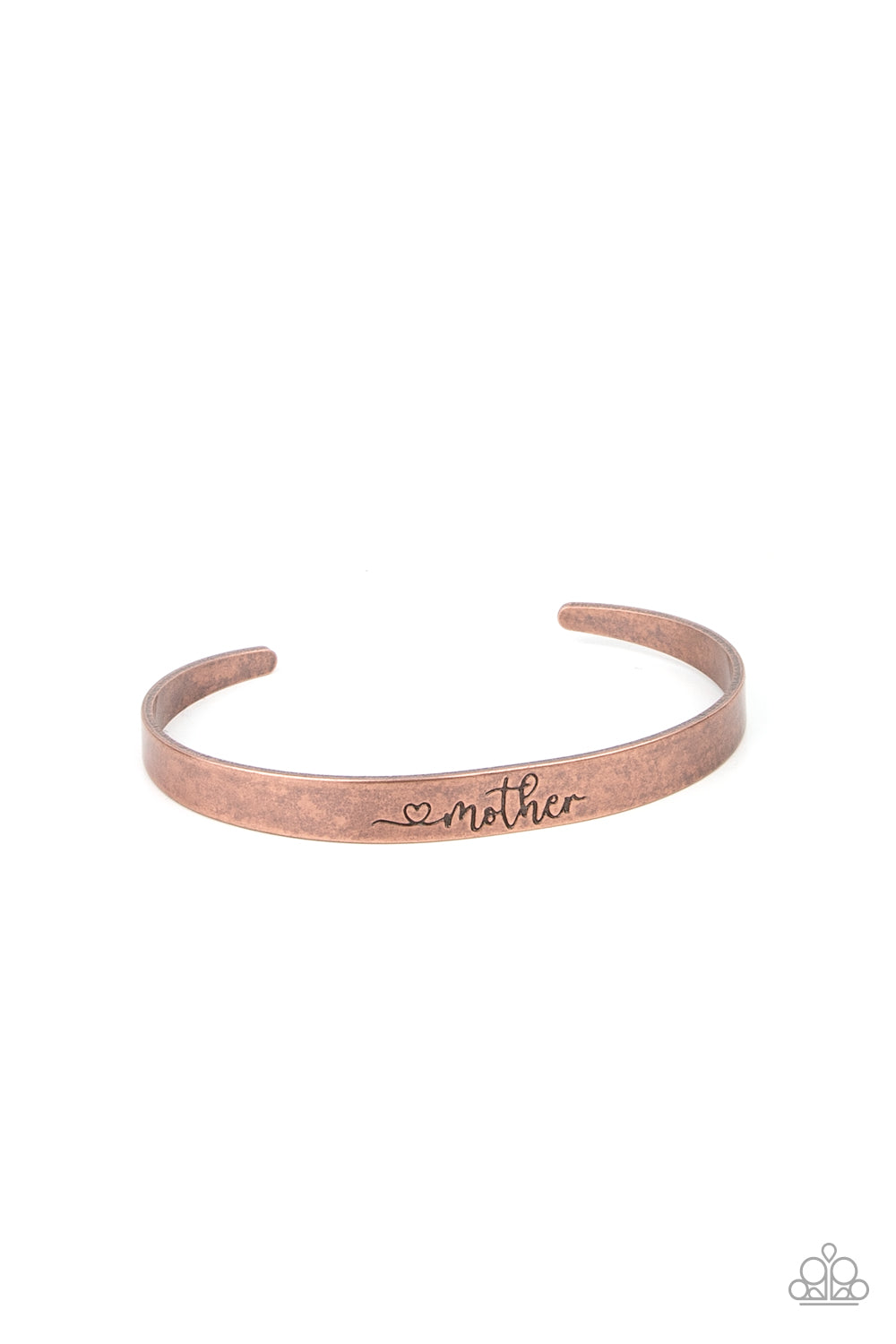 A dainty copper cuff is stamped in a heart and the word, "Mother," creating a rustic sentimental centerpiece around the wrist. Sold as one individual bracelet.