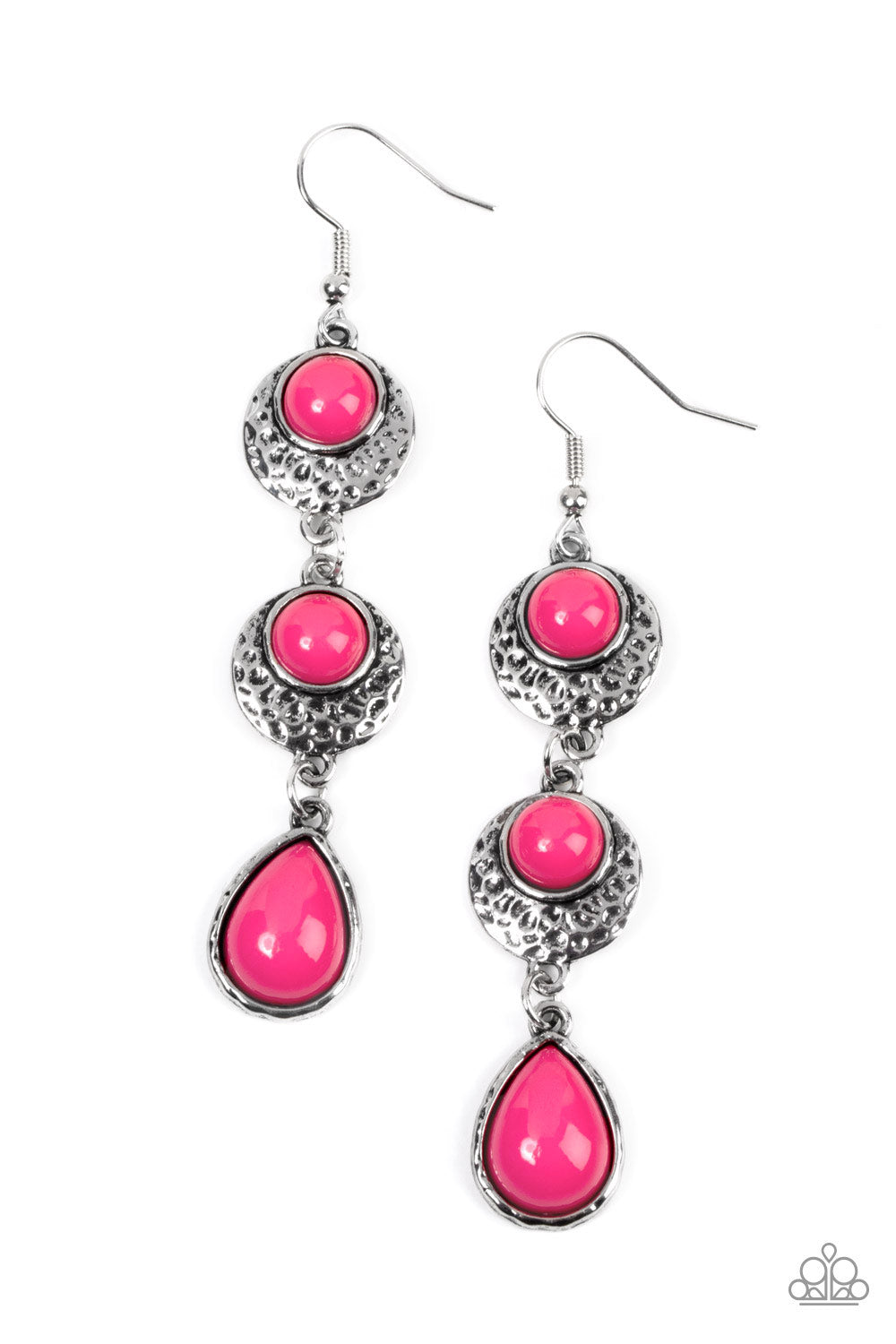 A vivacious pink teardrop bead swings from the bottom of a pair of pink dotted silver frames radiating with hammered texture, resulting in a colorfully stacked lure. Earring attaches to a standard fishhook fitting. Sold as one pair of earrings.