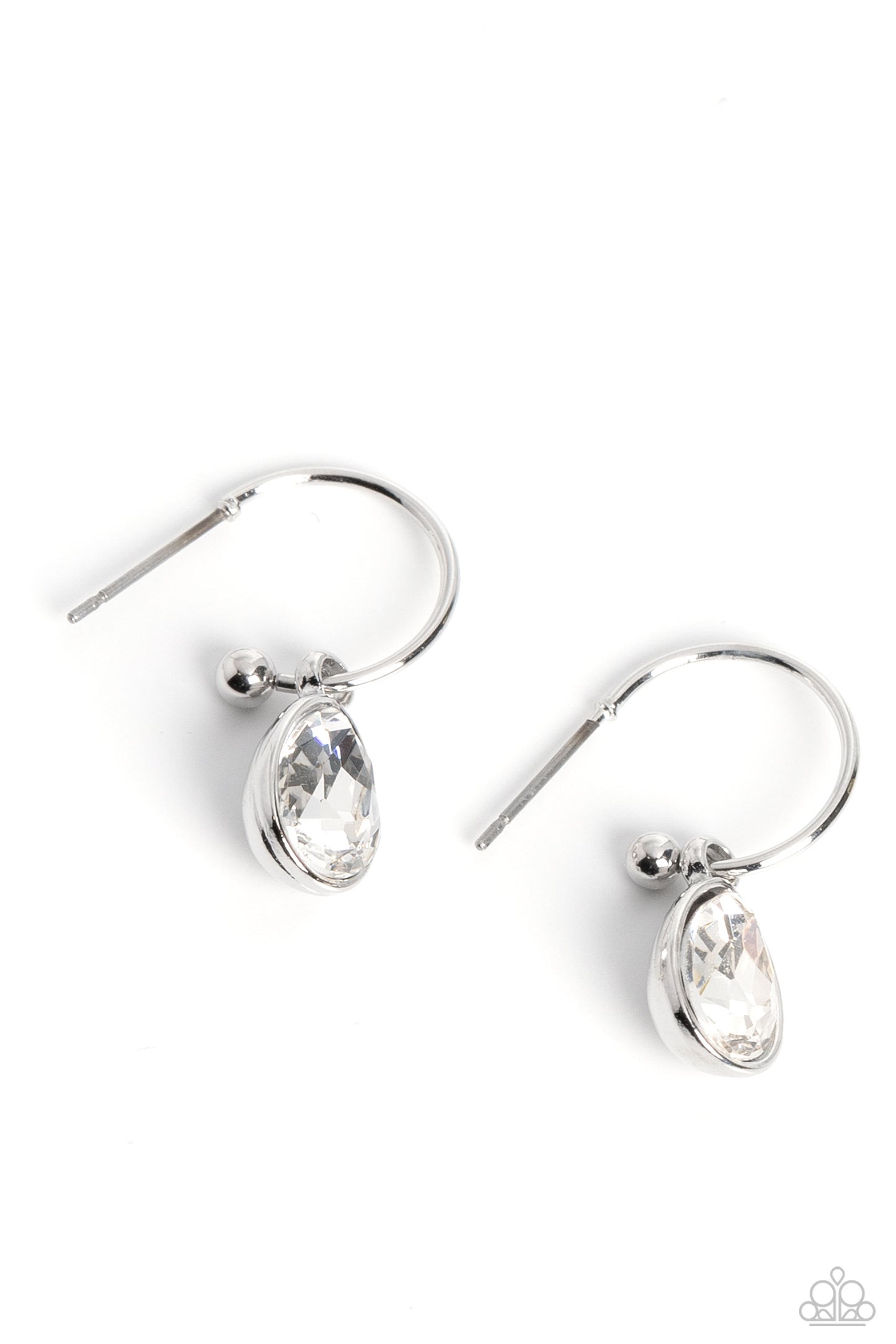 A small, skinny, shiny silver hoop curves around the ear in a timeless fashion. A shiny silver ball is affixed to the end of the hoop, reminiscent of a barbell fitting. A white, teardrop gem, encased in a shiny silver frame slides along the curvature of the hoop, adding a surprising hint of shimmery movement. Earring attaches to a standard post fitting. Hoop measures approximately 1/2" in diameter. Sold as one pair of hoop earrings.