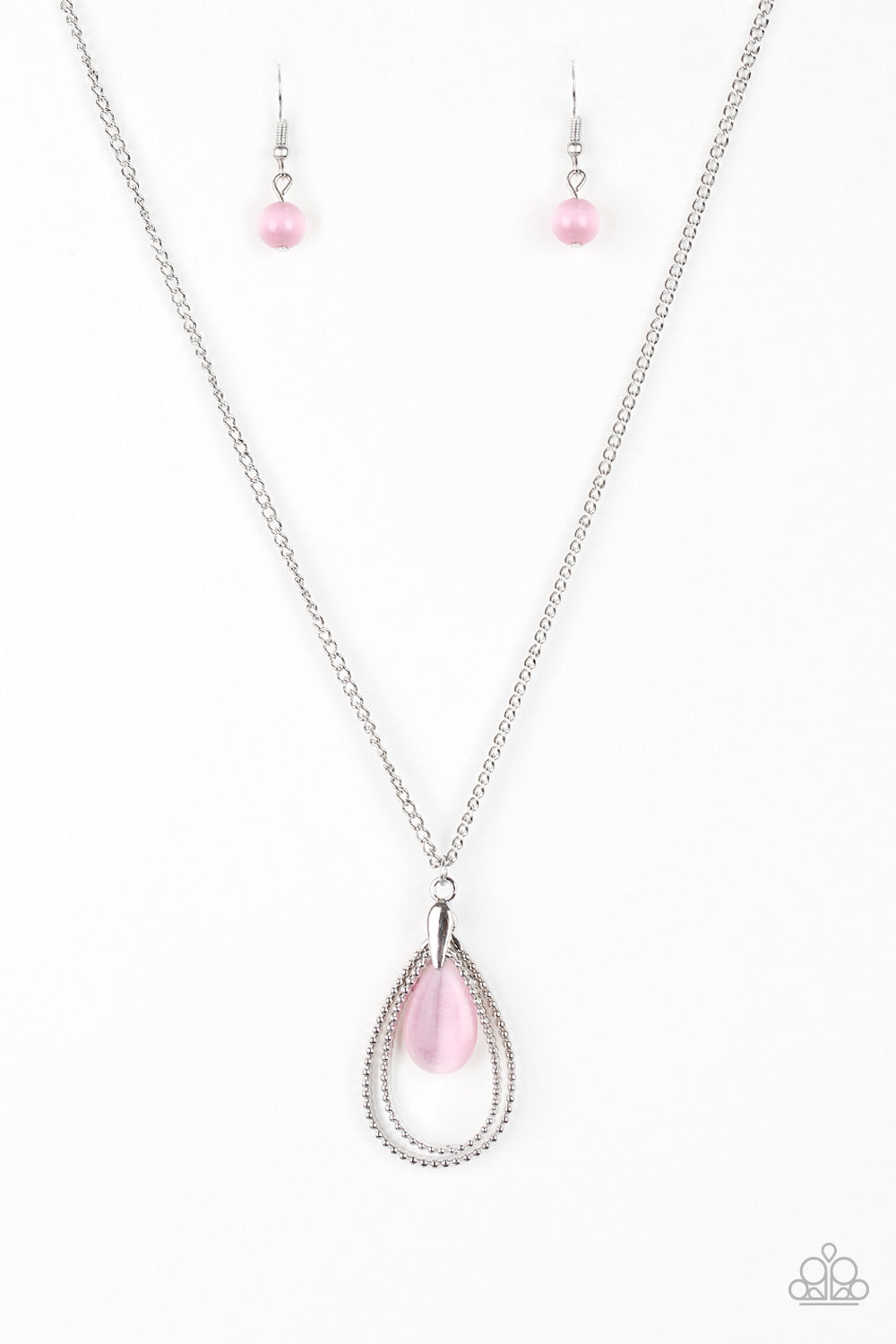 Studded silver teardrops swing from the bottom of a shimmery silver chain. A glowing pink moonstone attaches to the innermost frame, creating a whimsical pendant. Features an adjustable clasp closure. Sold as one individual necklace. Includes one pair of matching earrings.