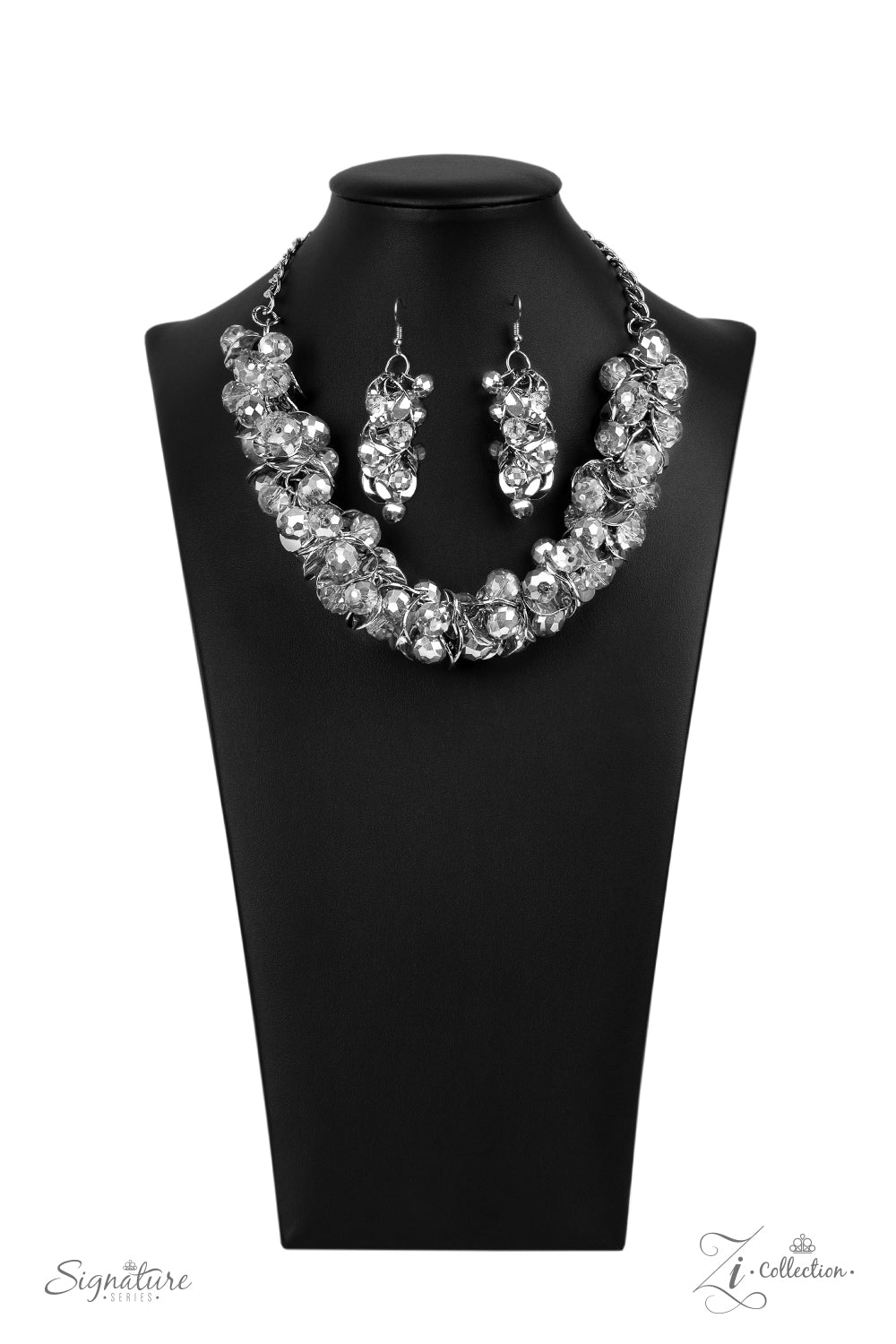 A brazen collection of metallic dipped crystal-like beads and delicately bent silver discs boldly cluster into a fearless fringe below the collar. The exaggerated display of jam-packed sparkle takes glitter to a whole new level with its unapologetic attitude. Features an adjustable clasp closure. Named after 2020 Rock the Runway winner, Haydee, F. Sold as one individual necklace. Includes one pair of matching earrings.