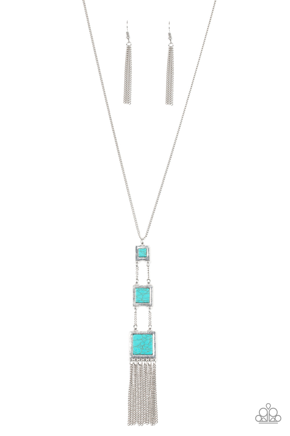 Square silver frames featuring turquoise stone centers, gradually increase in size as they link down the chest. Shimmery silver chains stream from the bottom, adding movement to the seasonal piece. Features an adjustable clasp closure.
Sold as one individual necklace. Includes one pair of matching earrings.