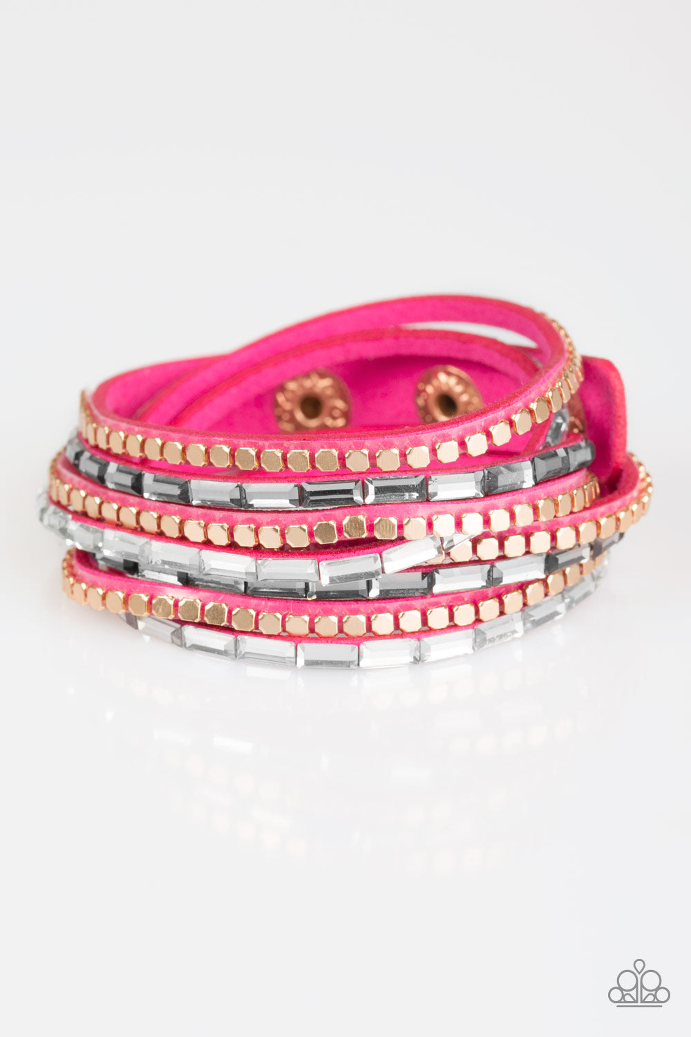 Smoky and white emerald cut rhinestones and flat gold cube beads are encrusted along strands of pink suede for a sassy look. The elongated band double wraps around the wrist for a fierce one-of-a-kind look. Features an adjustable snap closure. Sold as one individual bracelet.