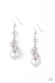 A bubbly white pearl, glassy crystal-like beads, and shimmery silver cube beads trickle along a glistening silver chain. An oversized white pearl swings from the bottom of the chain, creating a dramatic lure. Earring attaches to a standard fishhook fitting. Sold as one pair of earrings.