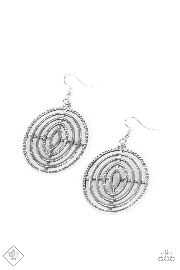 Oversized circular frames adorned in texture radiate from a central point, creating a dizzying design. Earring attaches to a standard fishhook fitting. Sold as one pair of earrings.