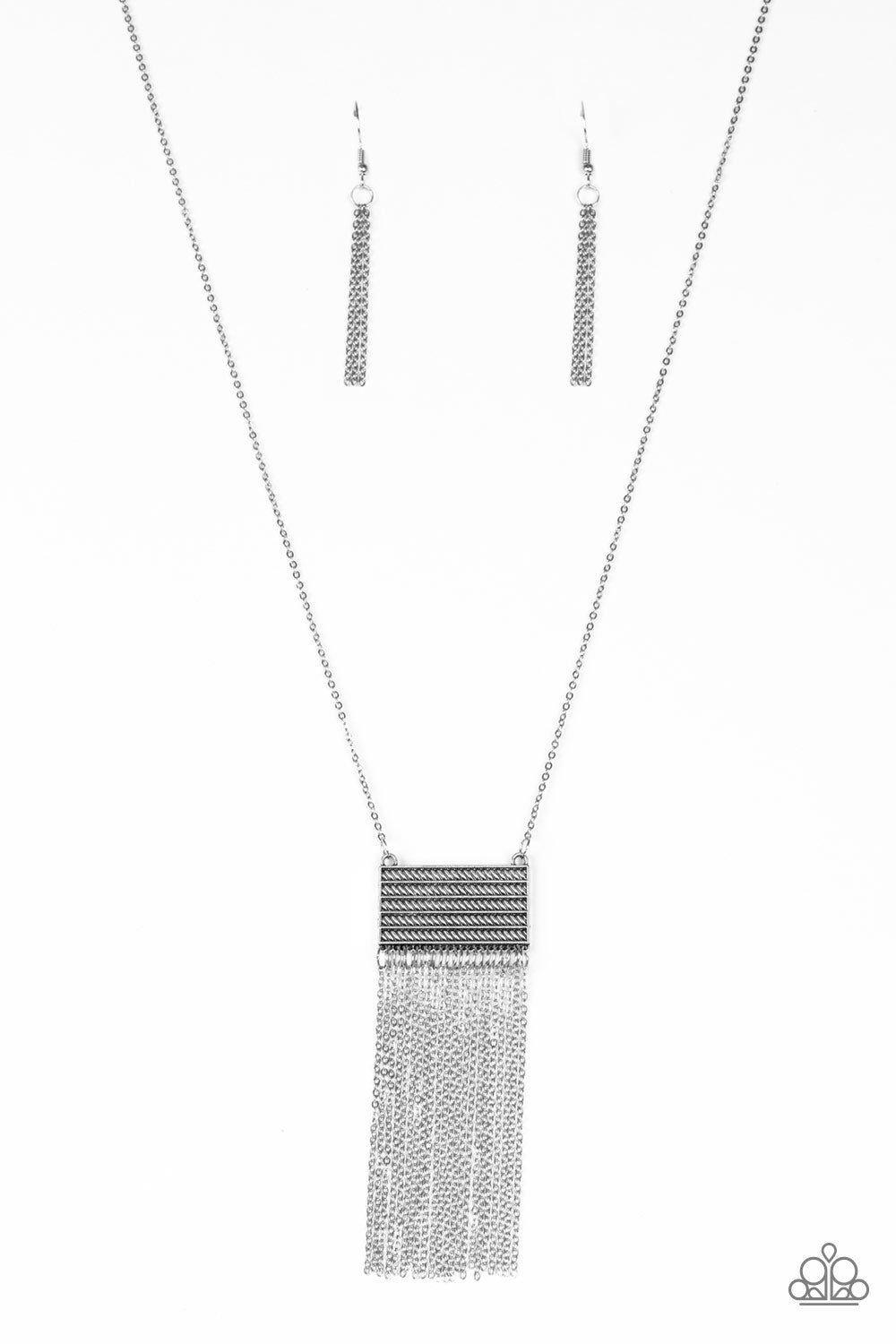 Radiating with glistening silver textures, a rectangular frame gives way to a dainty silver chain tassel for a seasonal look. Features an adjustable clasp closure.
Sold as one individual necklace. Includes one pair of matching earrings.