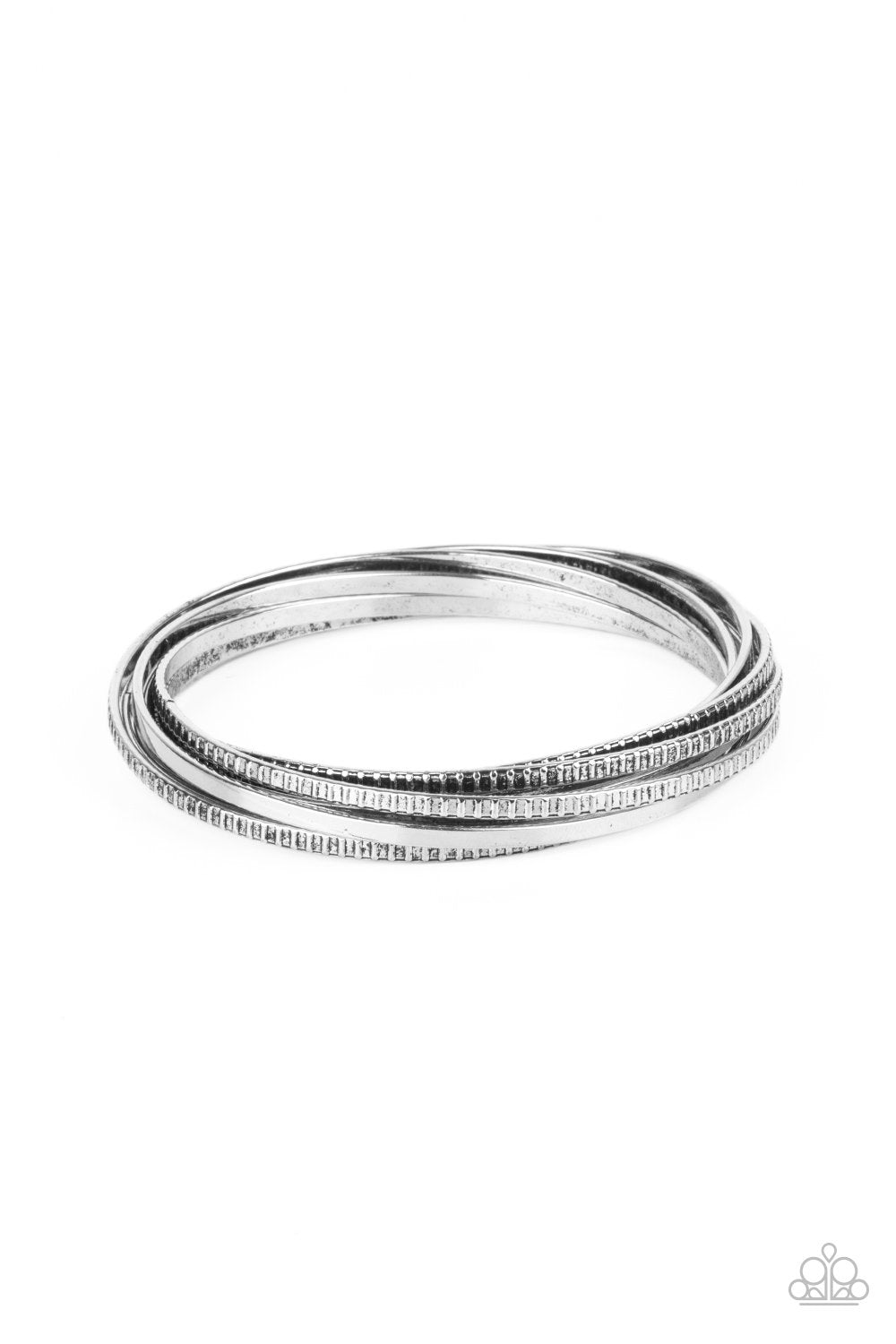 A set of four plain silver bangles interlocks with four silver bangles etched in a tread-like pattern, creating an edgy stacked look around the wrist.
Sold as one individual bracelet.