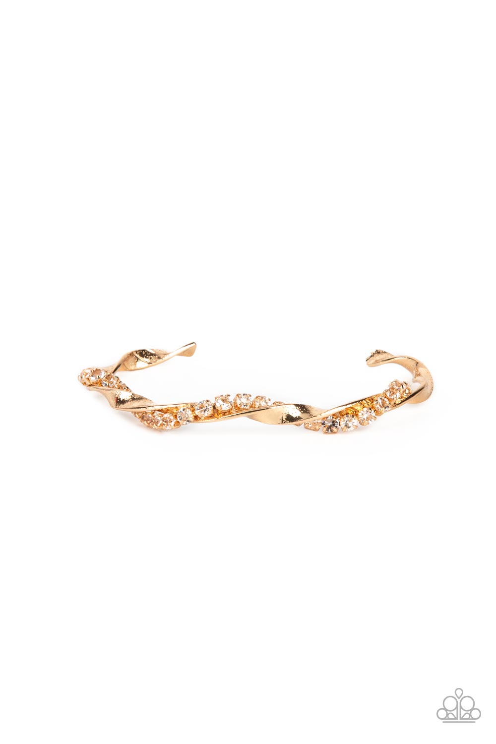 A glittery strand of glassy white rhinestones twists with a shiny gold bar around the wrist, creating a dainty cuff. Sold as one individual bracelet.