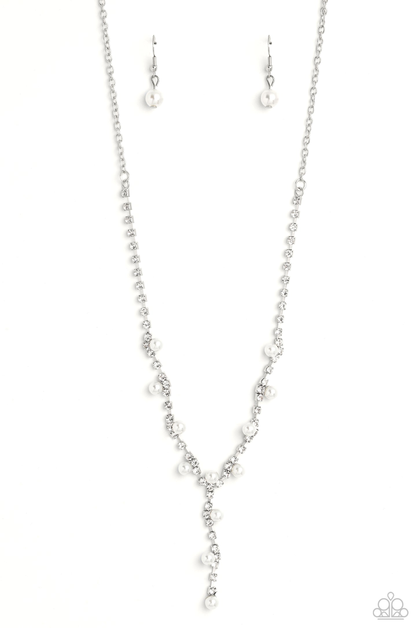 Attached to a section of dainty silver links, white rhinestones, pressed into shiny silver box chain fittings swing down the neckline in a lariat-like manner for an effulgent glow. Sporadically infused along the box chain fittings, high-sheen white pearls adorn the sparkly display for additional refinement and class. Features an adjustable clasp closure. Sold as one individual necklace. Includes one pair of matching earrings.
